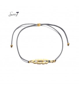 grijze elastische armband met goudkleurige detail met kleine kraaltjes