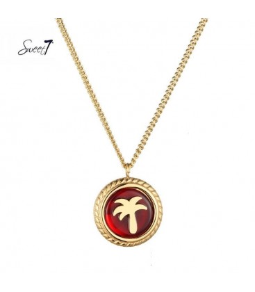 Goudkleurige ketting met ronde rode bedel met palmboom