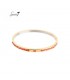 Goudkleurige bangle armband oranje gevlochten details