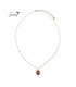 Goudkleurige ketting met rode kraaltjes en bedel met ster