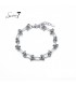 Zilverkleurige armband met schakels en knopen