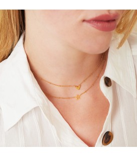 goudkleurige ketting met een open ster