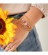Armband met lange goudgekleurde kralen en kleine paarse kralen