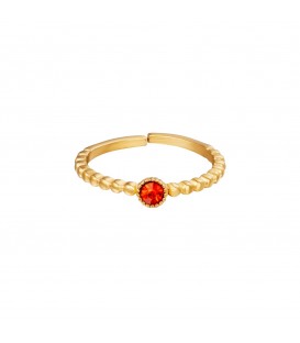 goudkleurige ring met rond rood zirkoonsteentje