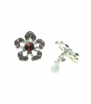 Zilverkleurige bloemvormige oorclips met paarse strass steentjes