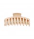 Grote beige haarclip met een glanzende afwerking