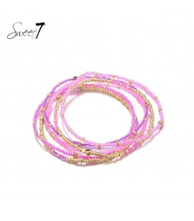 roze kralen armband met meerdere strengen en goudkleurige kralen
