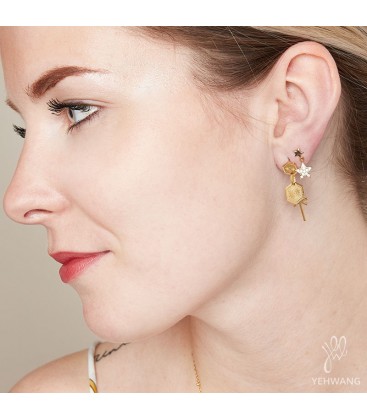 Asymmetrische oorbellen met sterrenbedel en ketting met ster