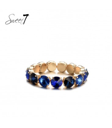 Goudkleurige armband met blauwe glas steentjes