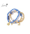 Blauw gekleurde armband met bedels