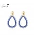 Blauwe raffia oorbellen met een glas stenen rand