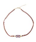 Zomerse, bohemian ketting met envelop bedeltje en gouden details