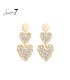 Oorbellen met dubbele harten en beige steentjes