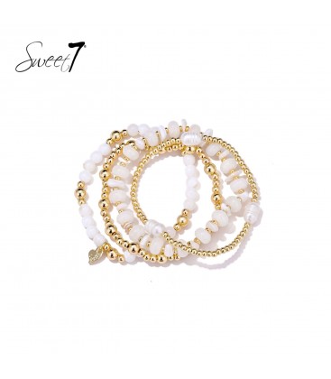 Armband met witte kralen en goudkleurige kralen
